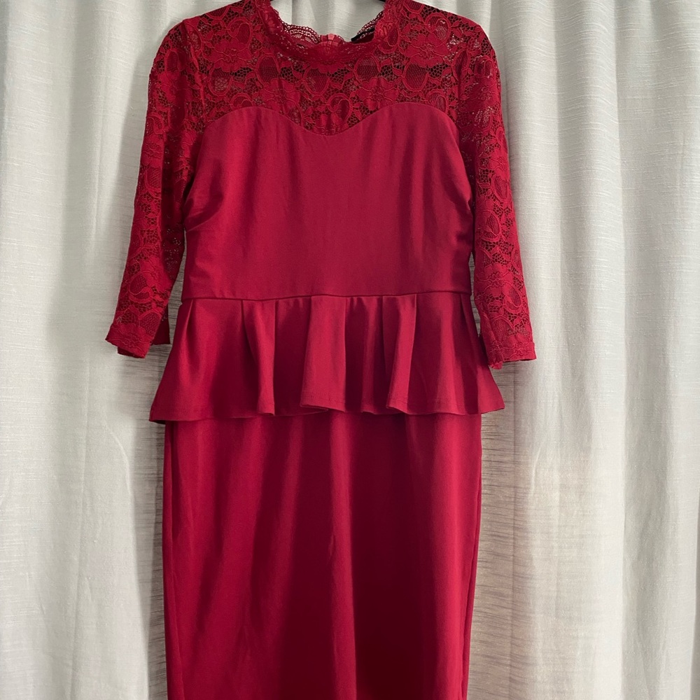 New, peplum, burgundy, just below the knee (depending on height) dress.